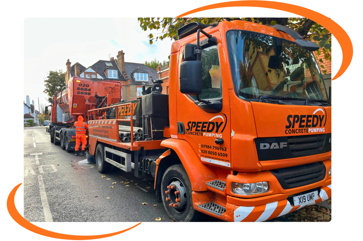 Readymix concrete mixer truck discharging into a concrete pump hopper